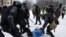RUSSIA – Russian police officers detain protester during an unauthorized protest in support of Russian opposition leader Alexei Navalny, in St. Petersburg, Russia, 31 January 2021