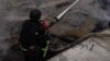 Ukraine -- Rescue workers fighting fire in Sumy region after a Russian strike, 15May2025 