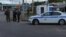 Russian law enforcement officers stand guard at a checkpoint in Belgorod