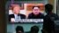 SOUTH KOREA -- People watch a TV screen showing file footage of U.S. President Donald Trump, left, and North Korean leader Kim Jong Un during a news program at the Seoul Railway Station in Seoul, South Korea, Wednesday, April 18, 2018. 