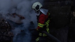 Ukraine -- Rescue workers at the site of Russian strike, Kyiv, 7Apr2025